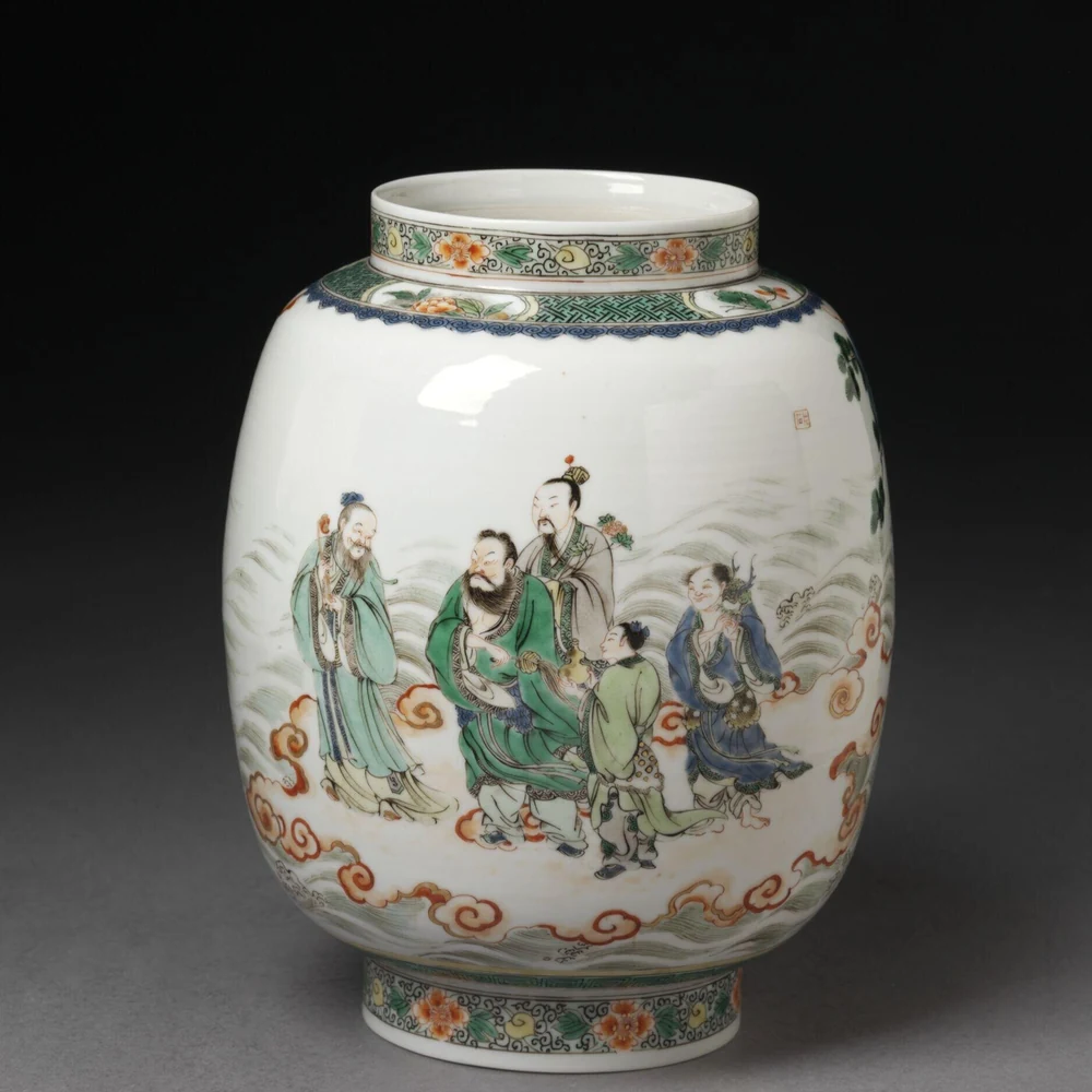 White porcelain lantern with short neck and foot, painted in green, red and blue famille verte enamels with five Daoist immortals standing among waves and clouds; floral bands decorate the neck and foot. Chinese, Lantern with Daoist Immortals, Kangxi period (1662–1722), 20.3 cm. Image from Victoria and Albert Museum. (Related image located during this archive's reconstruction.)