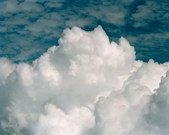 Photograph by Barry Andersen of white cumulus clouds against a blue sky. Barry Andersen, cloudscape. Image from the artist's website. (Related image located during this archive's reconstruction.)
