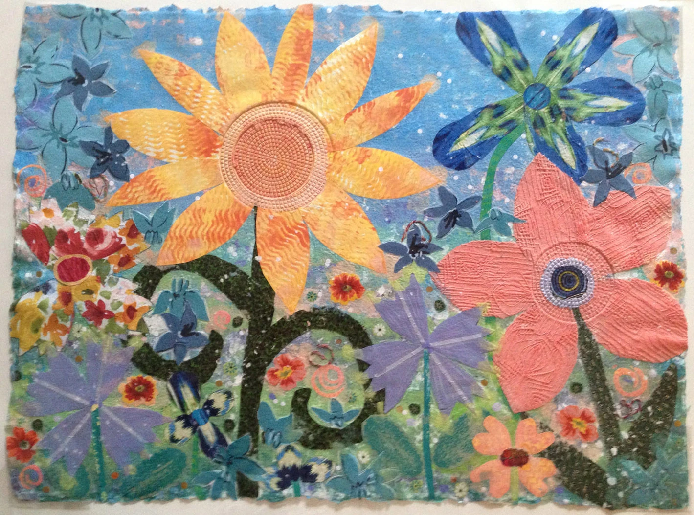 Handmade paper pulp painting collage by Margaret Rhein with a large sunflower and colorful flowers. Margaret Rhein, Sunflower Morning. Image from the artist's website. (Related image located during this archive's reconstruction.)