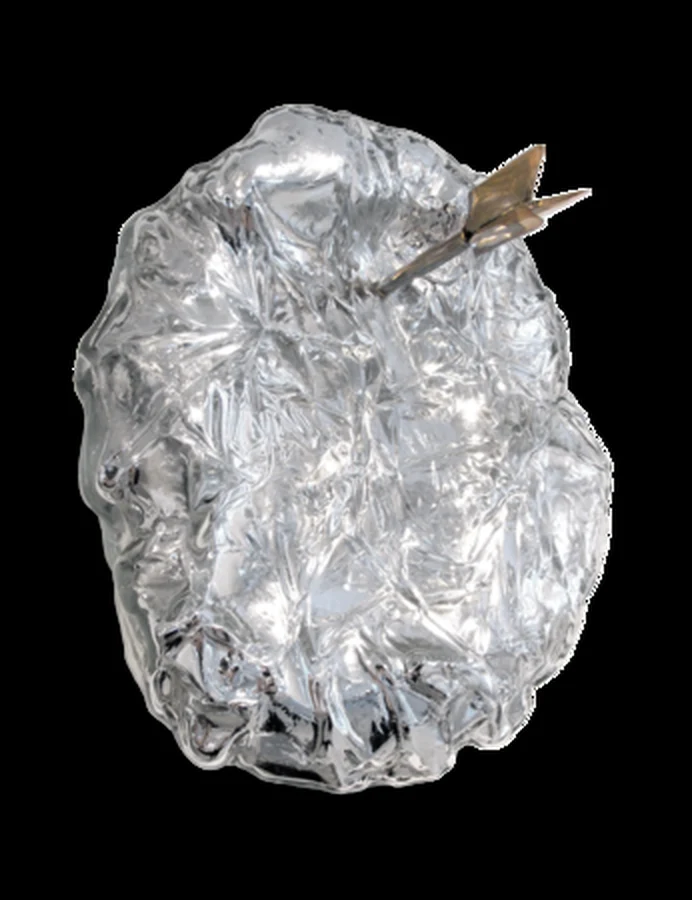 A crinkled translucent glass balloon form with a golden arrow driven through it.