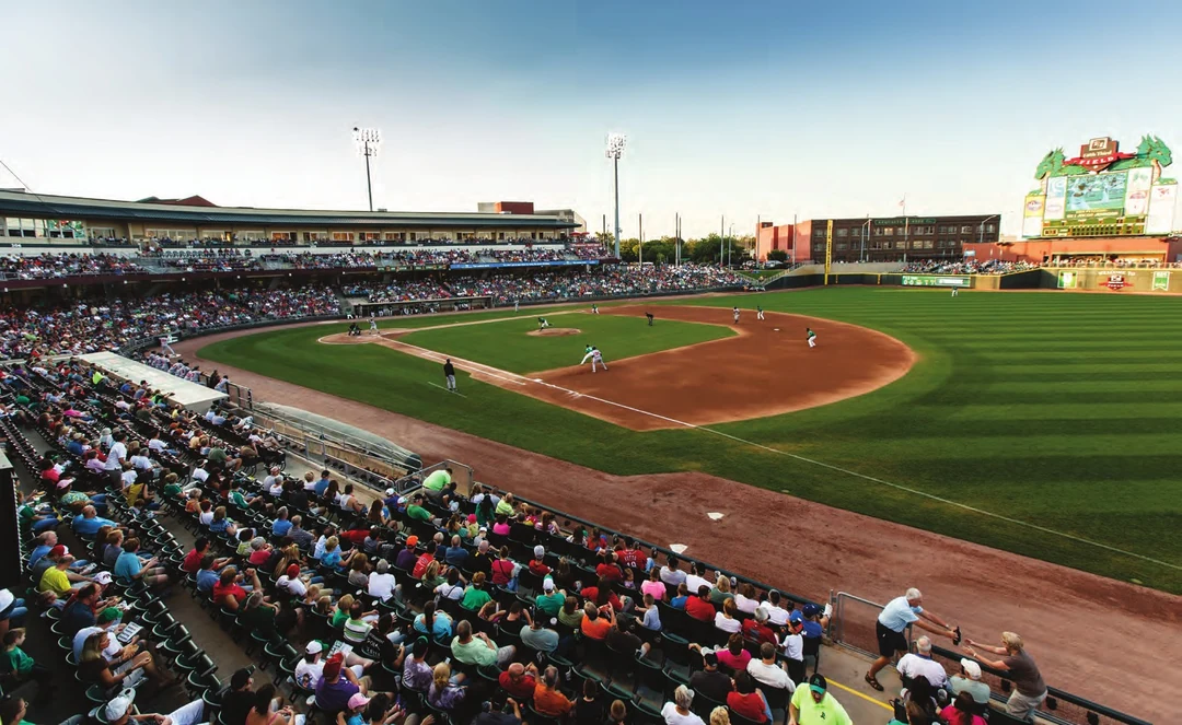 Baseball game in a packed stadium, green field and crowded stands. Photograph by Andy Snow. Image from A Flood of Memories (Miami Conservancy District, 2013). (Related image located during this archive's reconstruction.)