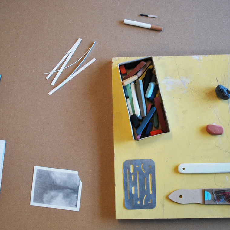 Drawings and sculptures from Cynthia Gregory's The Poet's Table, photographed on a tabletop. Image from the artist's archived website.