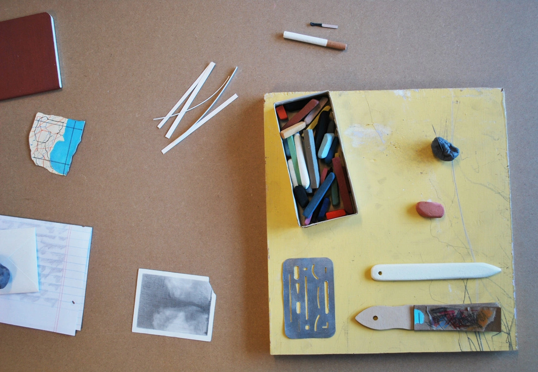 Drawings and sculptures from Cynthia Gregory's The Poet's Table, photographed on a tabletop. Image from the artist's archived website.