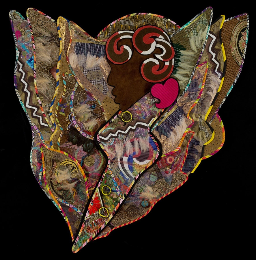 Fiber artwork by Cynthia Lockhart: a dark profile with red, white and black curls surrounded by wing-like layers of patterned textiles, beads and bright accents.
