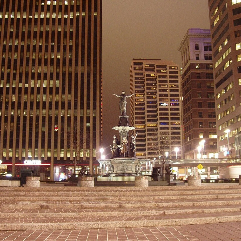 Fountain Square at night with the Tyler Davidson Fountain in Cincinnati.