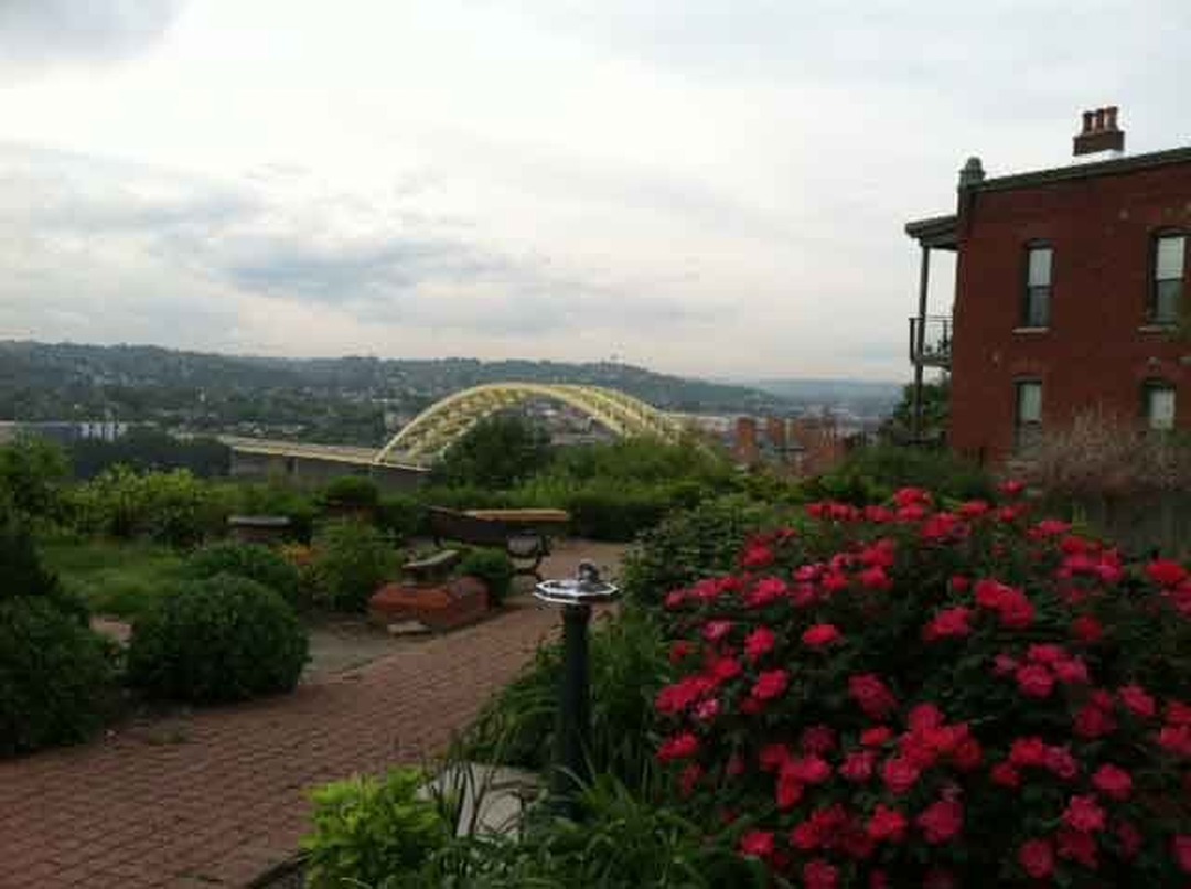 Garden with red roses overlooking a bridge and the river valley, Mt. Adams, Cincinnati
