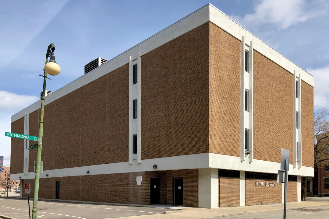 Brick facade of the Lloyd Library building in Cincinnati, its name on the wall, seen from the street corner.