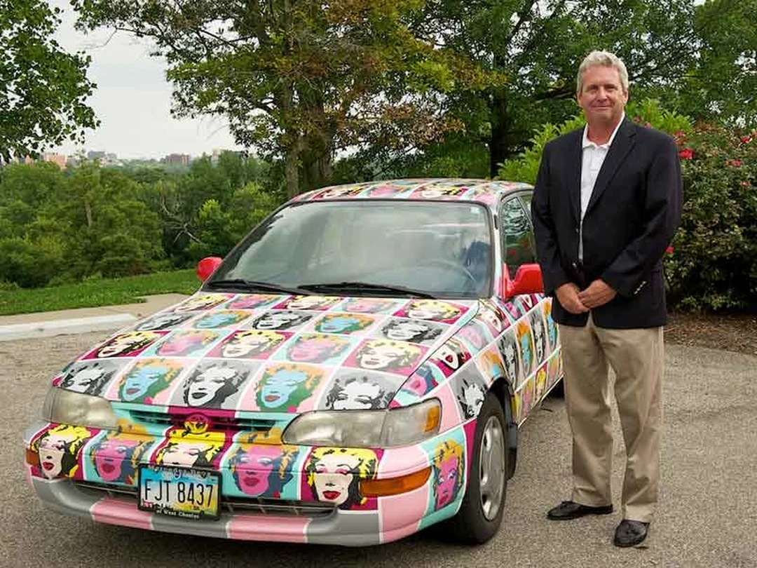 Kip Eagen standing next to the Warhol Marilyn art car.