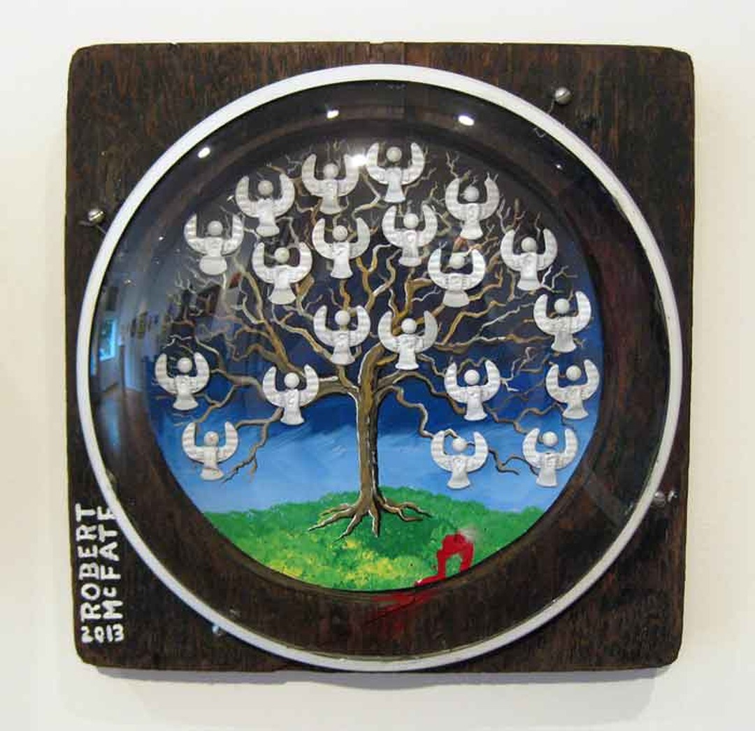 Circular painting of a tree with white angel figures against a blue sky, signed Robert McFate 2013