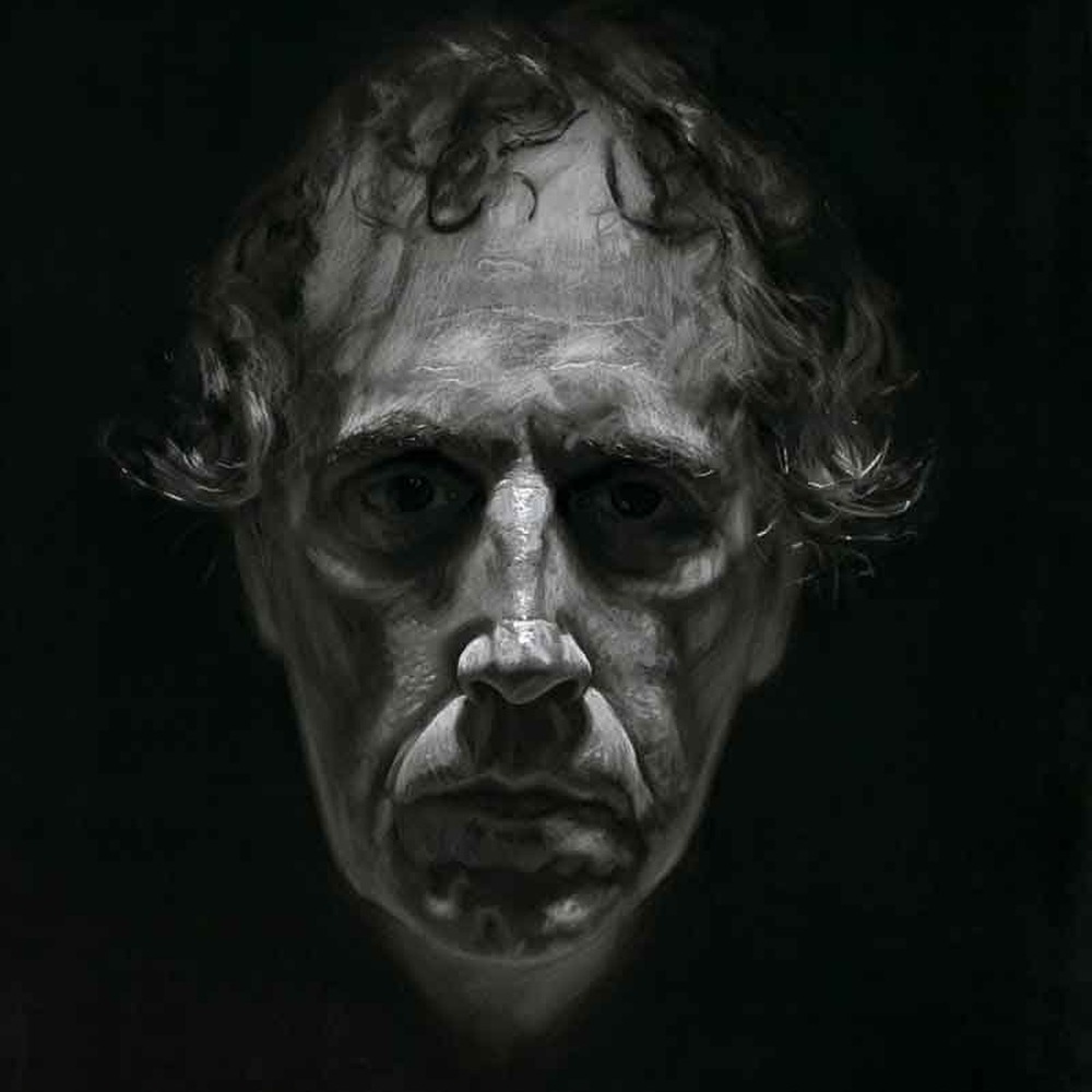 Detailed charcoal and acrylic study of a man's head by Mark Hanavan, intense close-up portrait