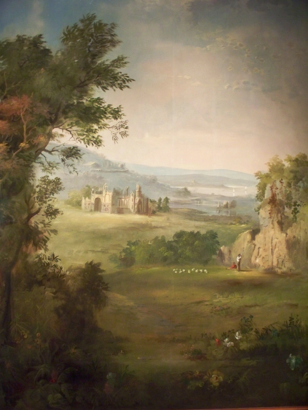 Robert S. Duncanson’s painted landscape mural in the Taft Museum of Art: a pastoral valley with a distant castle under a bright sky, framed by trees.