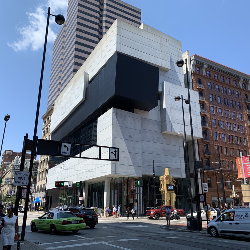 The Contemporary Arts Center in Cincinnati, a white geometric concrete building with a black angular section, seen from the street