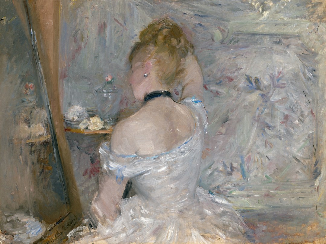 Berthe Morisot's Woman at Her Toilette: a woman seen from behind arranging her hair before a mirror, in soft impressionist brushwork