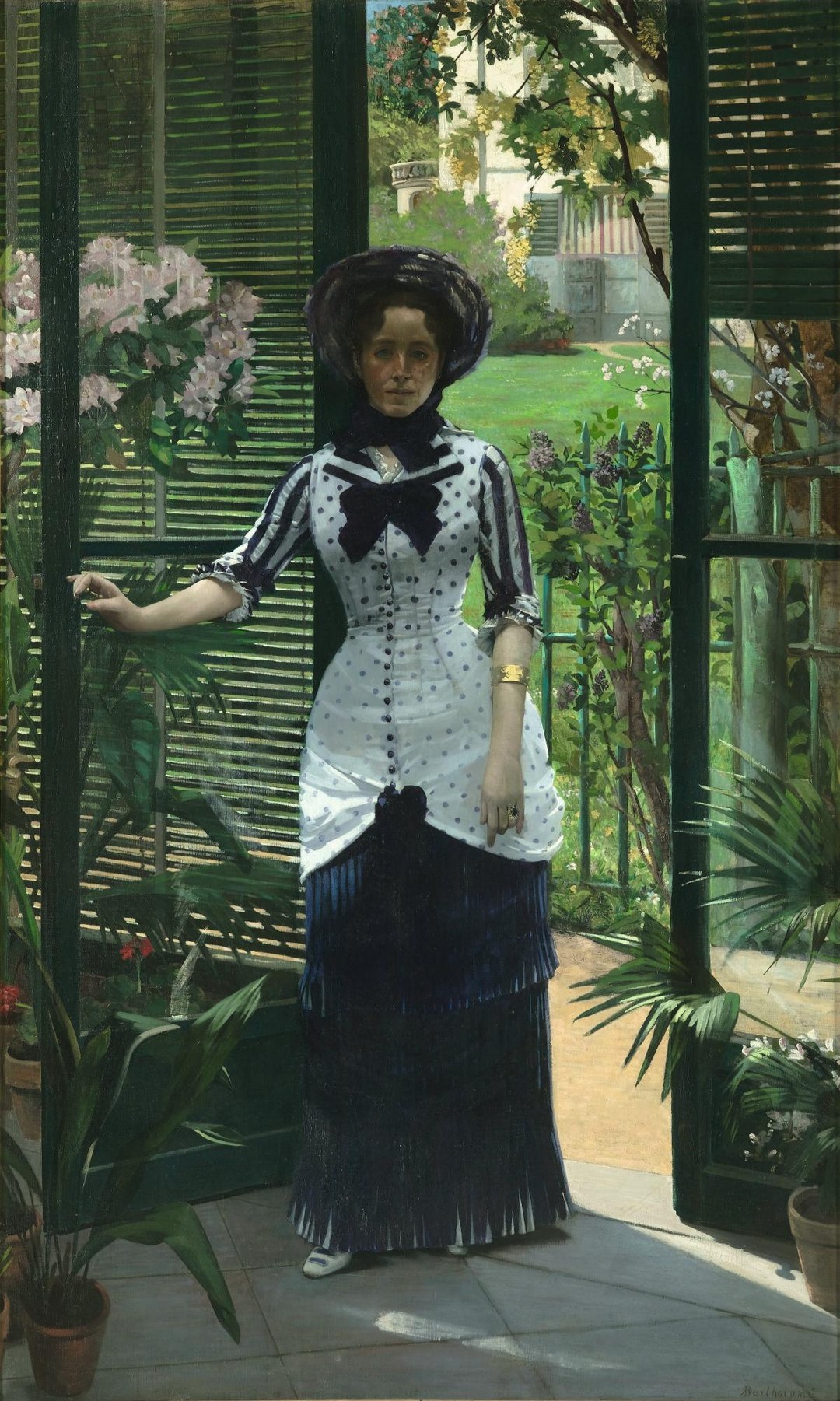 Albert Bartholome's 1881 painting In the Conservatory: full-length portrait of a woman in a polka-dot dress standing in a greenhouse doorway