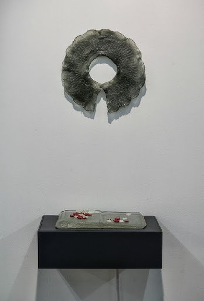 Sculptural artwork combining natural materials and cast glass