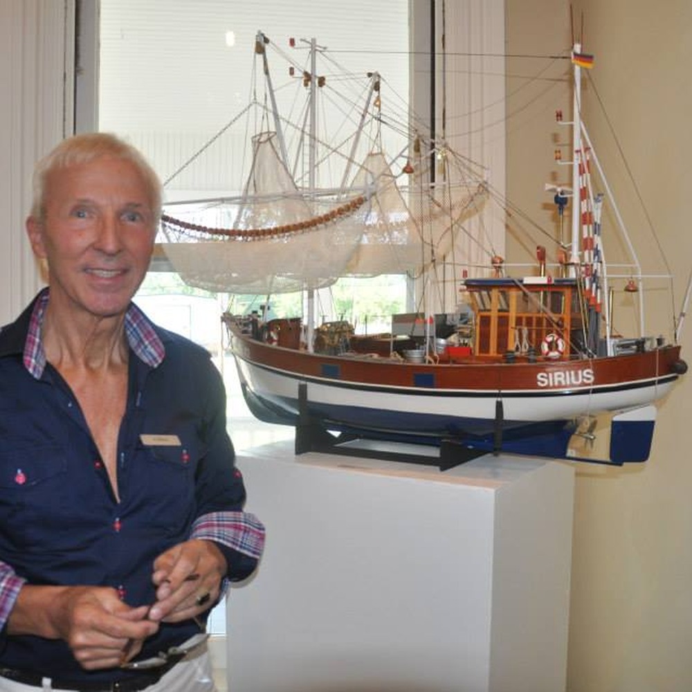 Ship modelmaker Guenther Waesch with his model ship