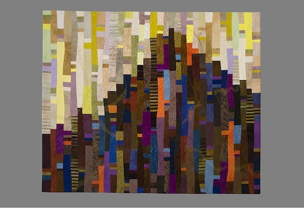 Sandra Palmer-Ciolino, Martello #7, cotton hand-dyed fabrics by Virginia Keiser, hand-painted striped batik by Debra Lunn, commercial cotton fabrics, wool batting, color and silk threads machine-pieced, and machine-quilted. 66.5” x 55”. Photo courtesy of Kennedy Heights Arts Center