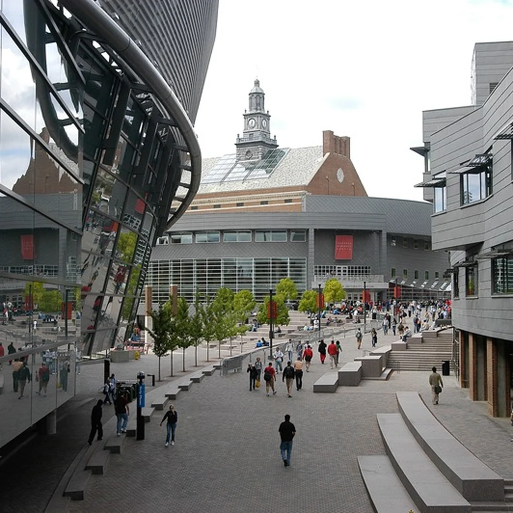 Pedestrians on Main Street at the University of Cincinnati, with the modern Steger Student Life Center on the right.