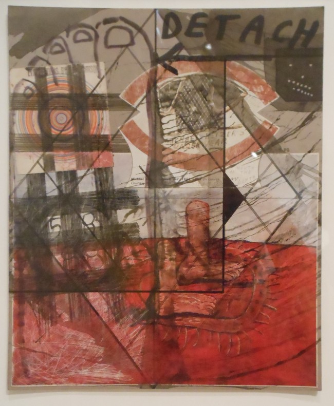 Close-up of a red and black Ray Johnson collage with the word “Detach” and target-like circles. Photo: Cynthia Kukla.