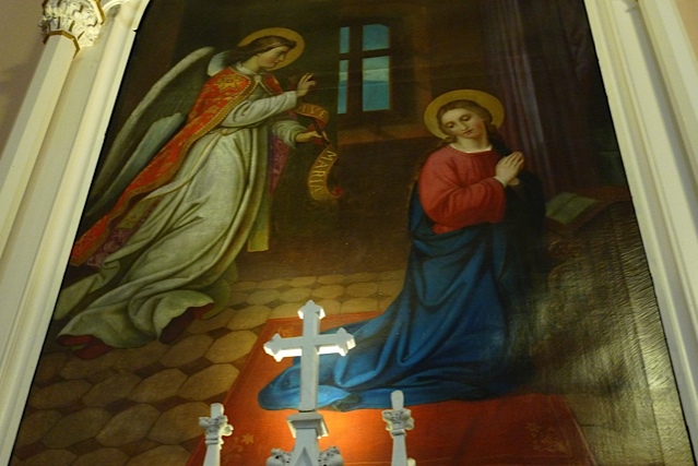 Johann Schmitt's Annunciation mural in the Church of the Immaculata, Mt. Adams: the angel Gabriel appearing to the Virgin Mary, with altar crosses in the foreground.