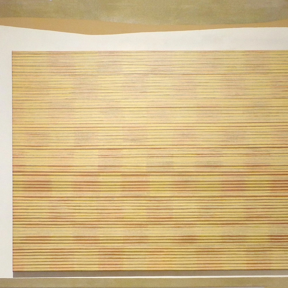Painting of fine horizontal yellow and red-brown lines on a rectangular canvas, framed by a pale layered border on a tan ground.