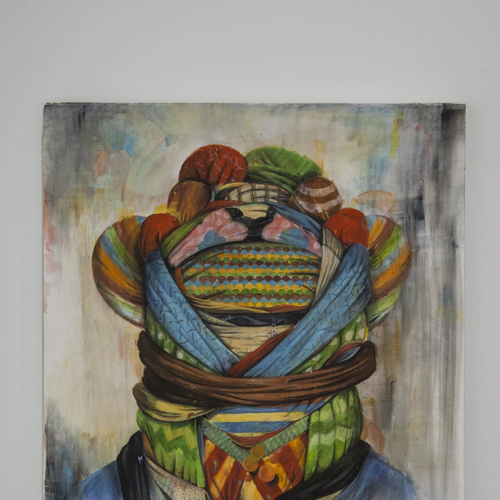 Painting of a figure whose head is wrapped in layers of striped and patterned scarves and a brown rope, against a pale background.