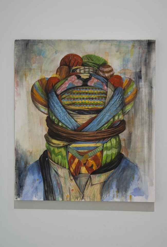 Painting of a figure whose head is wrapped in layers of striped and patterned scarves and a brown rope, against a pale background.