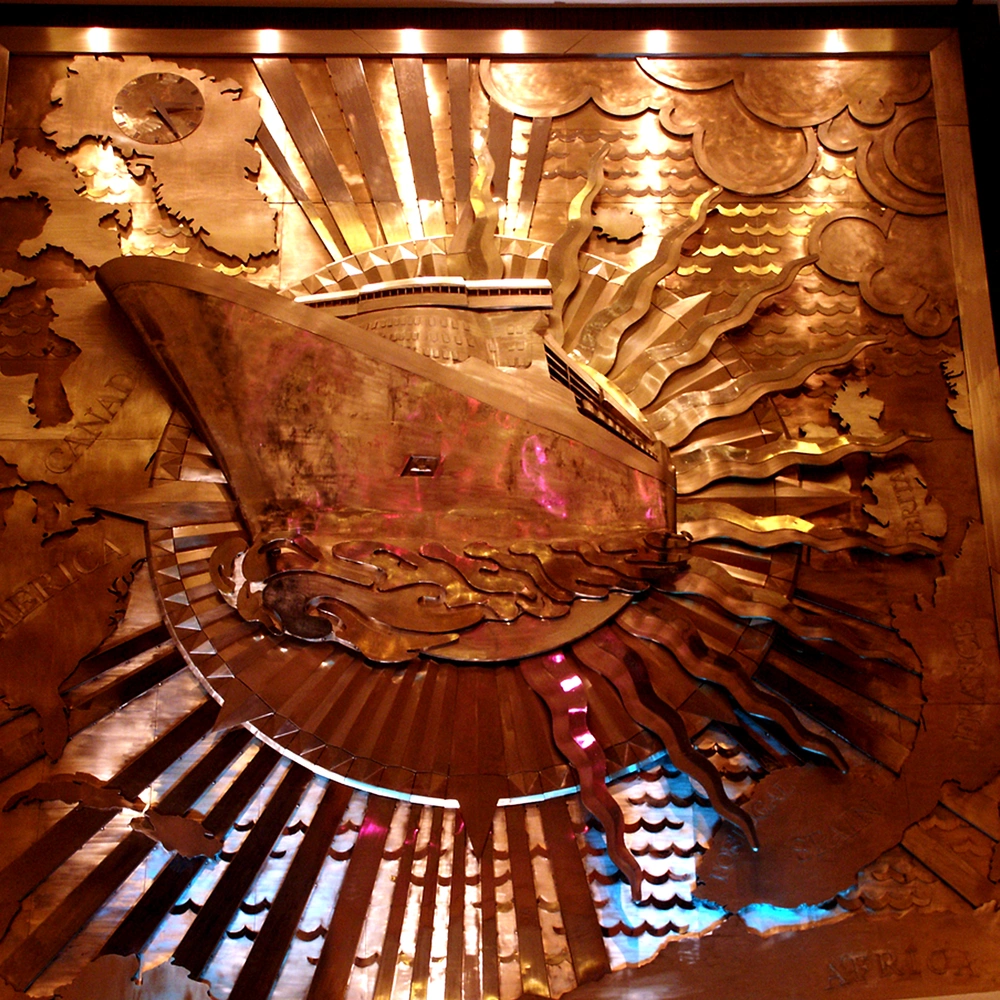 Square Art Deco bronze relief of an ocean liner with radiating sun rays and waves.