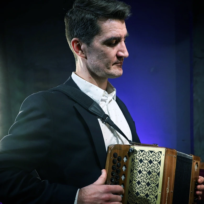 a man playing an accordion