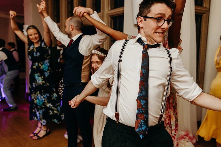 Guests dancing at a wedding with the Kent ceilidh band playing live music.