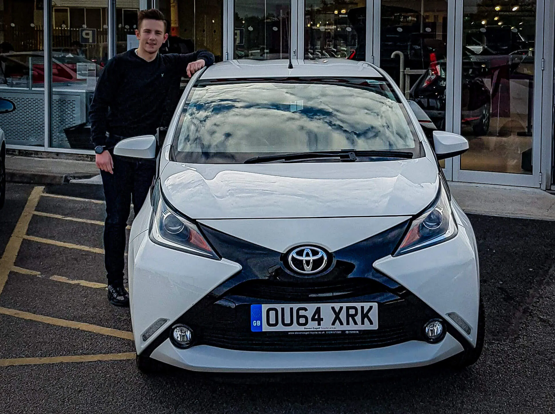 Dygas Detailing owner Emil Dygas next to his first car Toyota Aygo