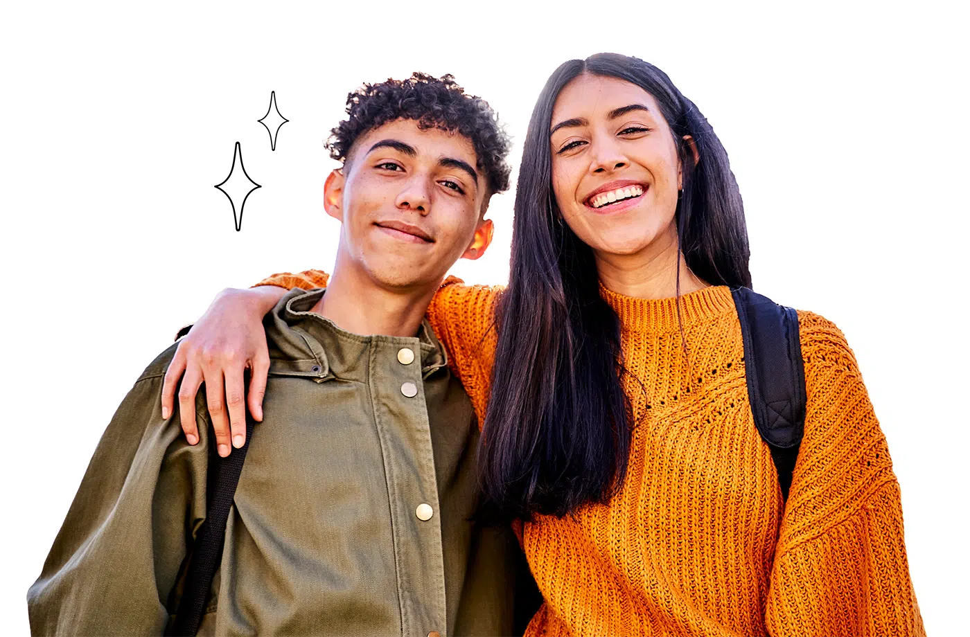 Smiling teenage boy and girl with backpacks, the girl wearing an orange sweater and the boy in a green jacket, posing closely together.