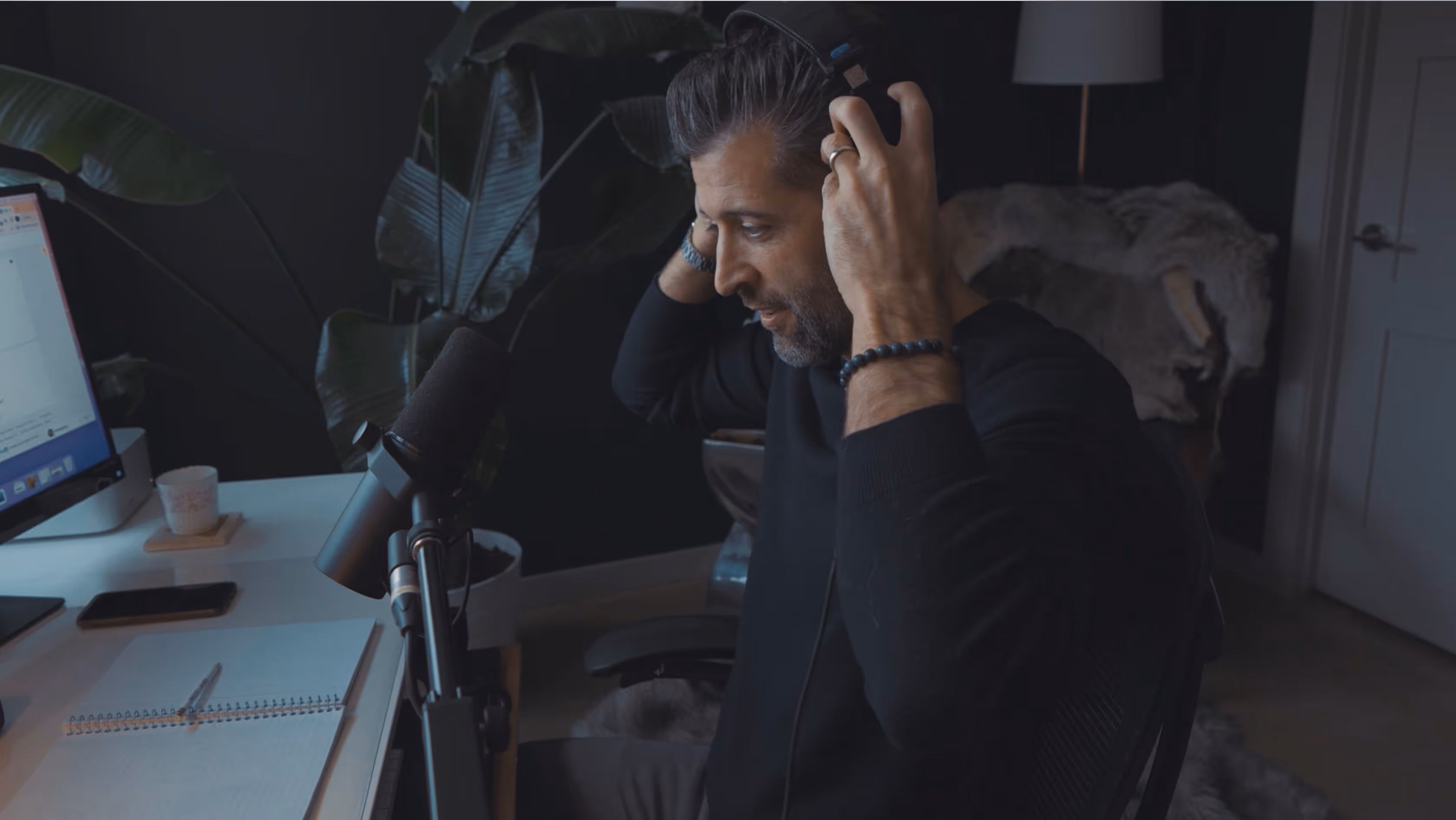 Tyler preparing to record a podcast