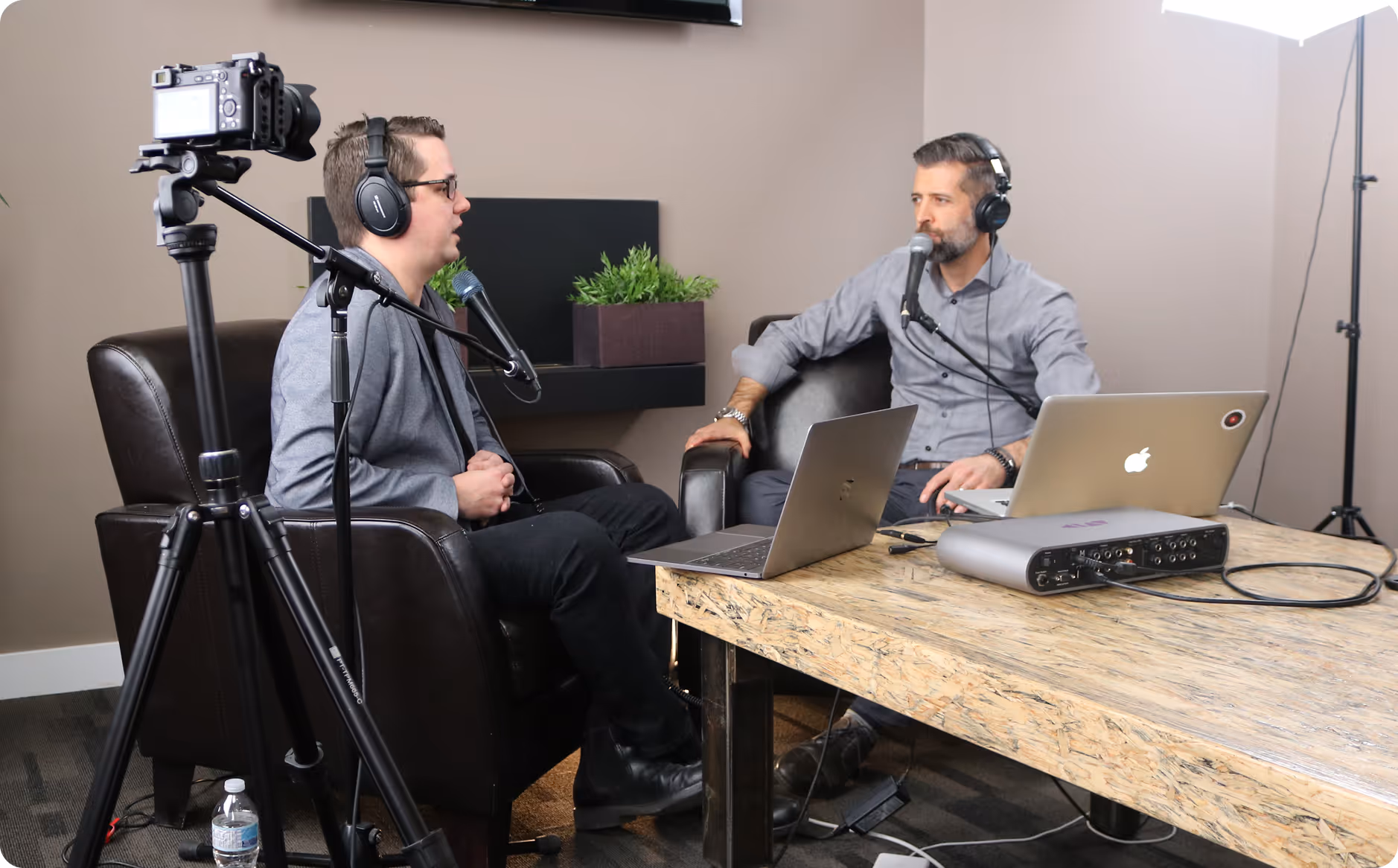 Tyler interviewing a guest on a podcast
