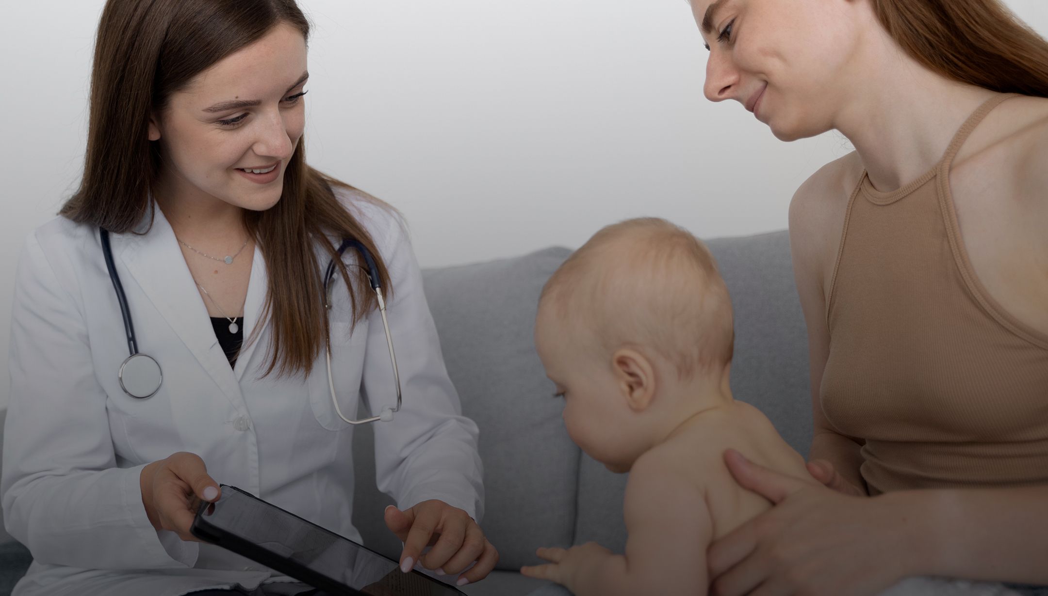 A clinician reviewing results with a parent and child