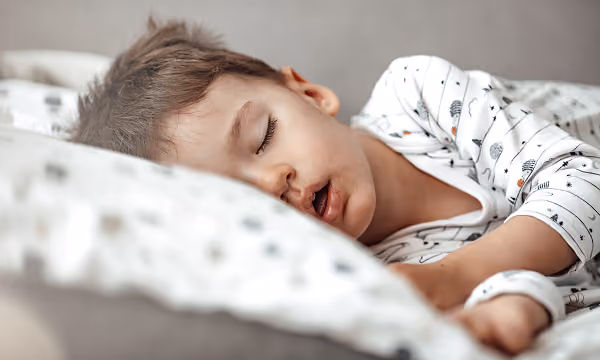 A child asleep, snoring