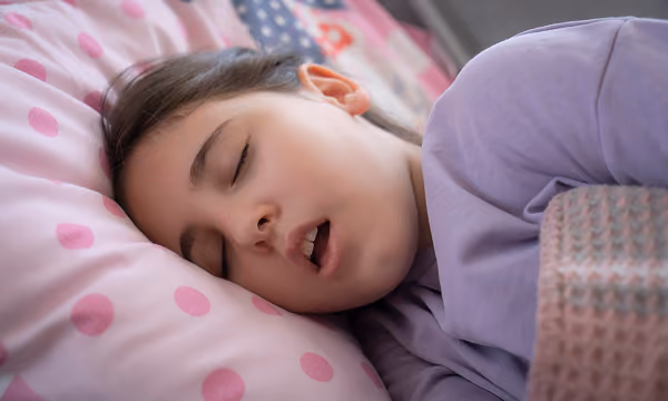 A child asleep in bed