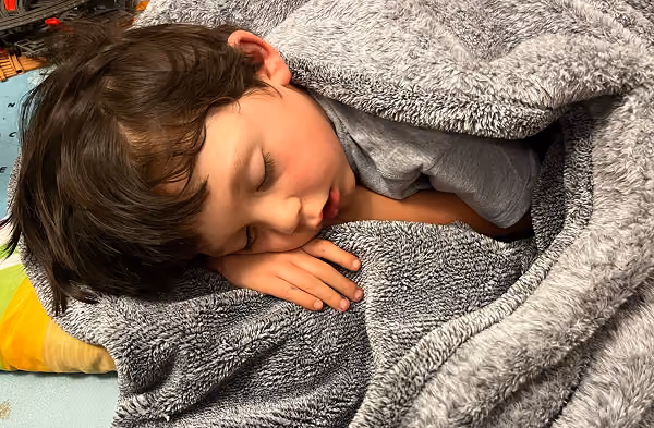 A child asleep in bed