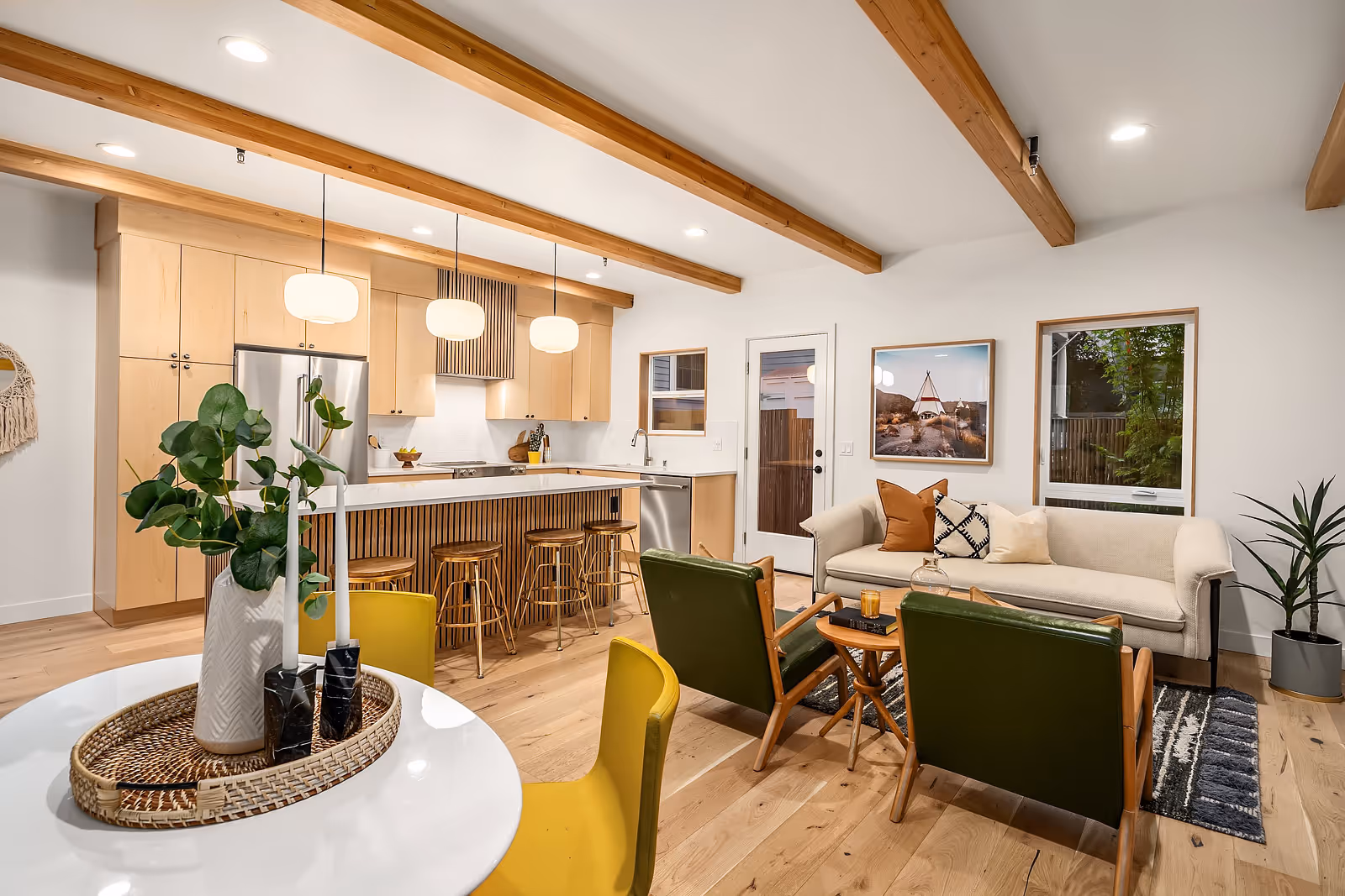 a wide view of the open concept living room, kitchen and dining room 