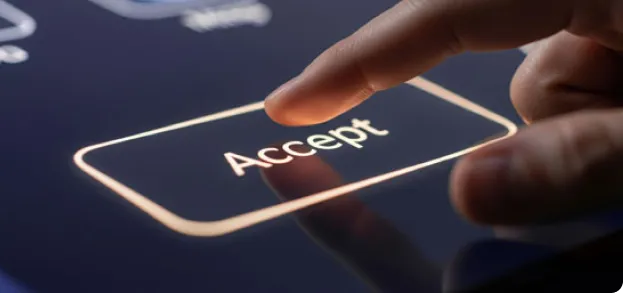 close up of finger pressing accept button on screen
