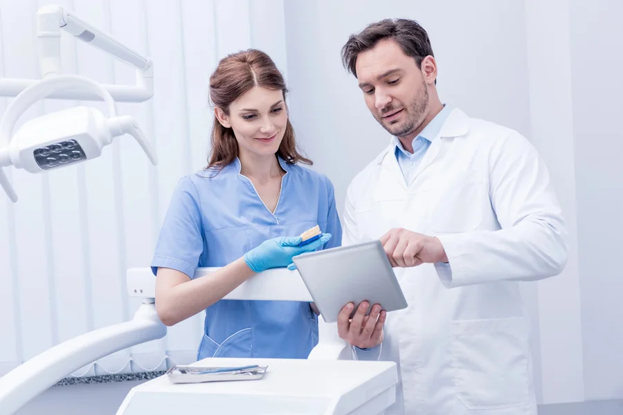 dentist-queens-ny-reviewing-treatment-plan-with-patient