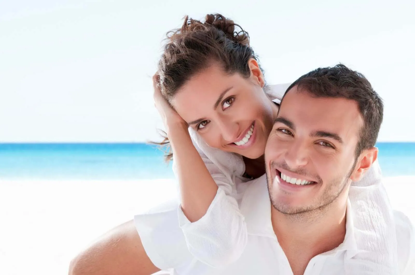 man and woman smiling