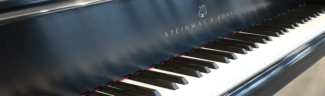 Image of an elegant piano showing its keys.