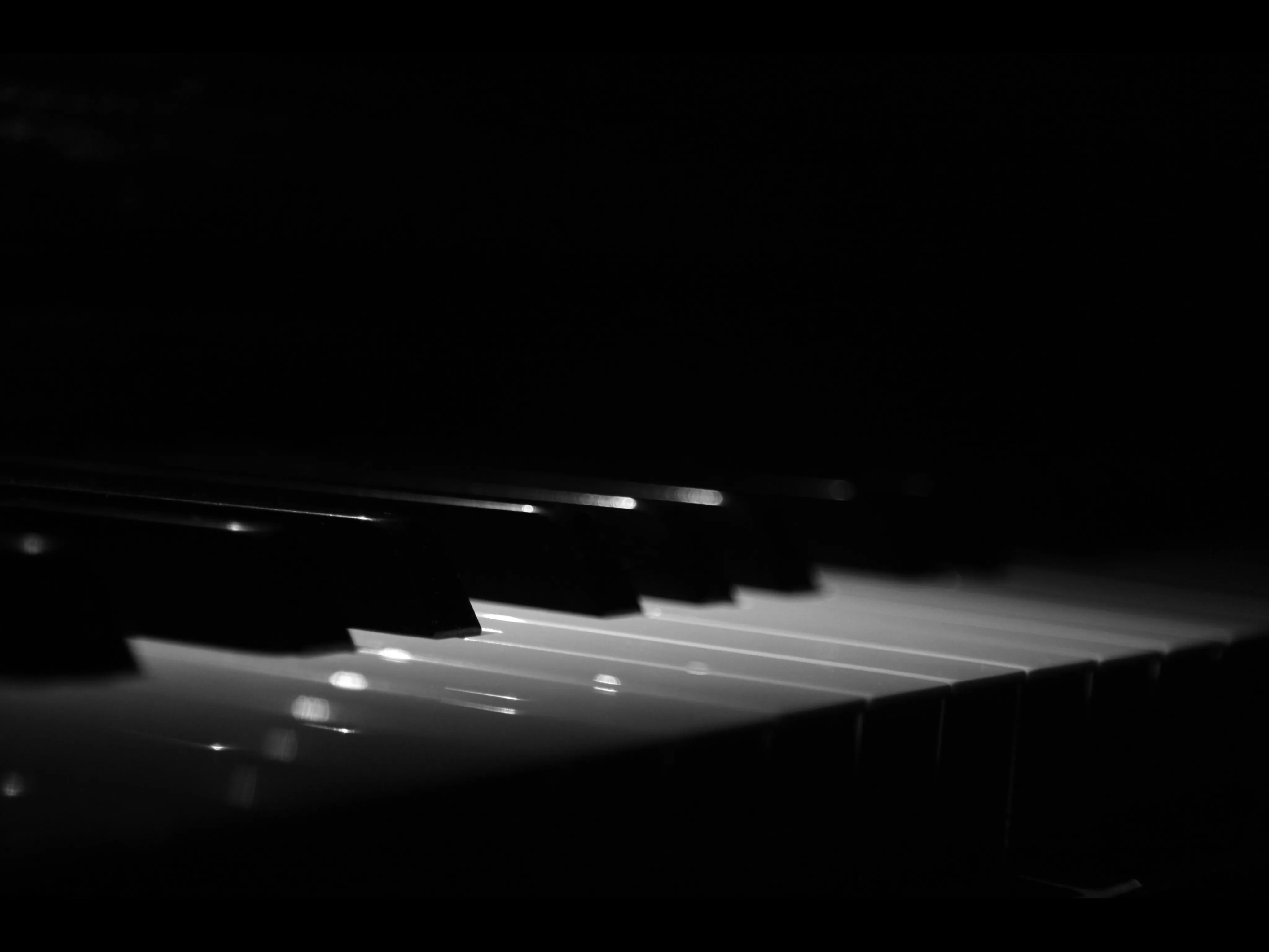 Image of an elegant piano showing its keys.