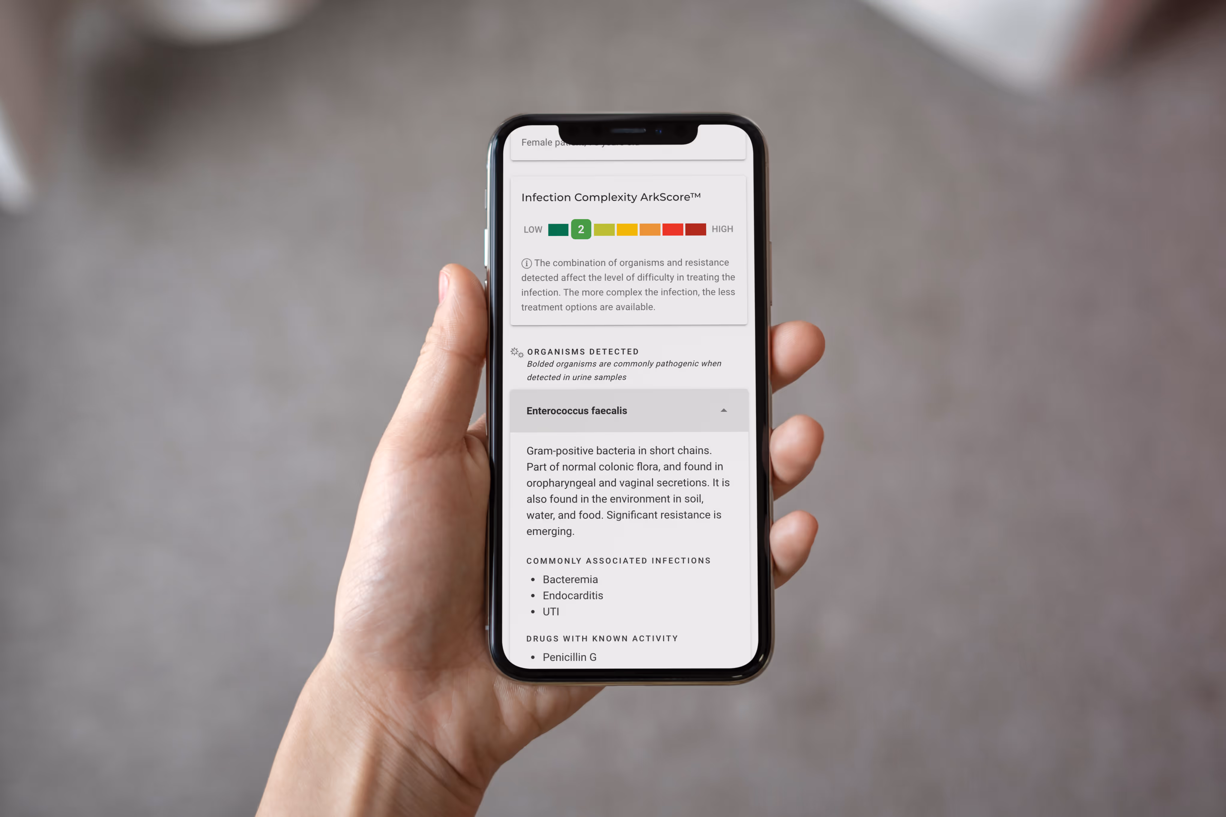 Hand holding smartphone displaying the OneChoice app.