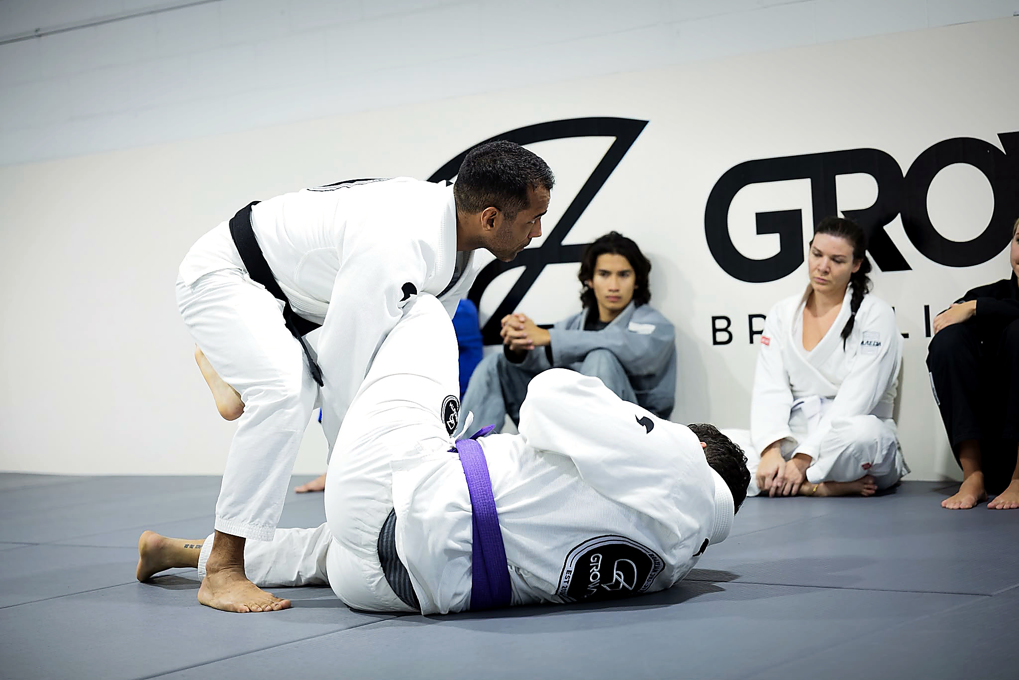 Coach teaching Gi Jiu-Jitsu technique at Growth BJJ