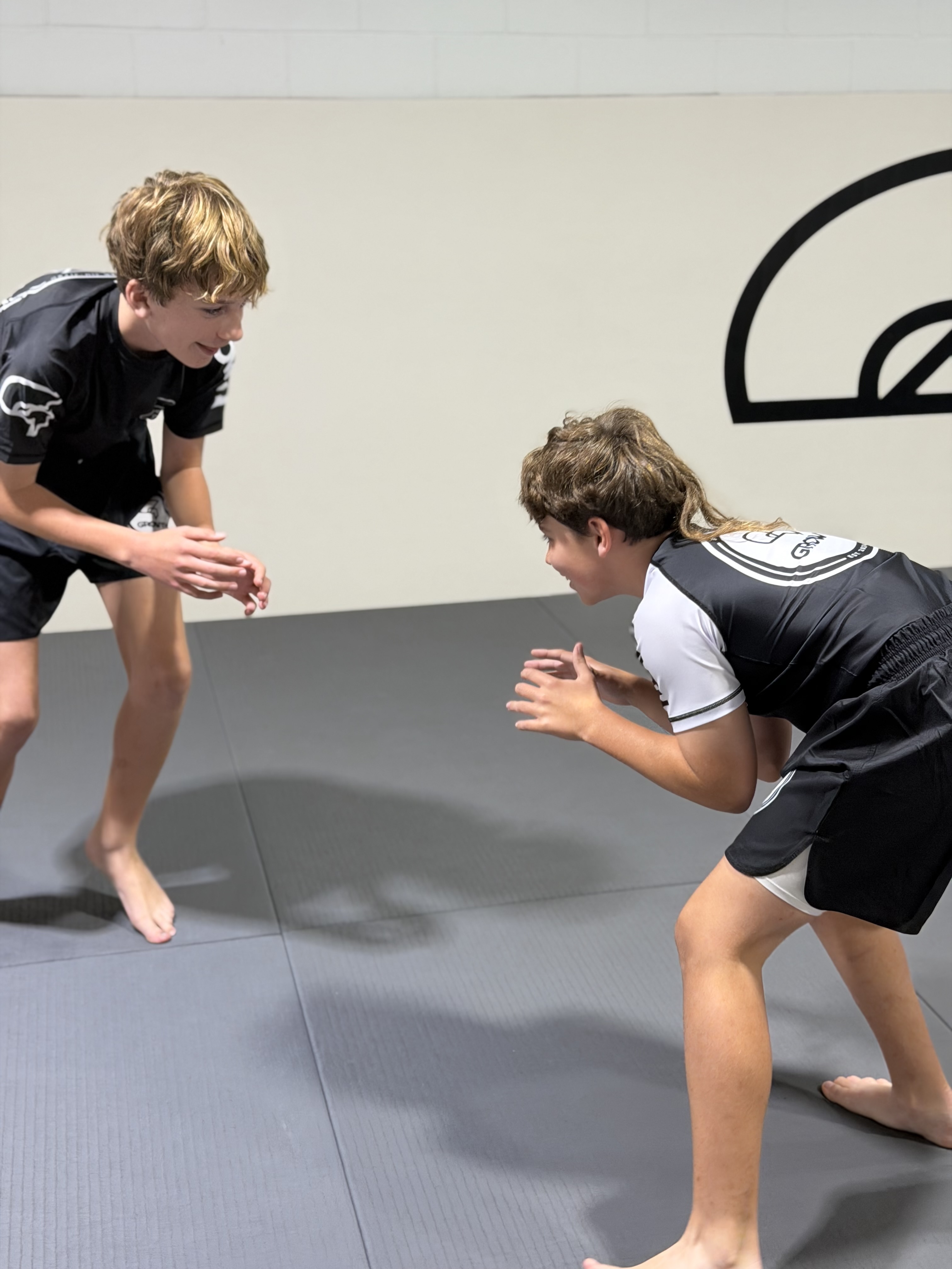 Teens grappling during Jiu-Jitsu class at Growth BJJ