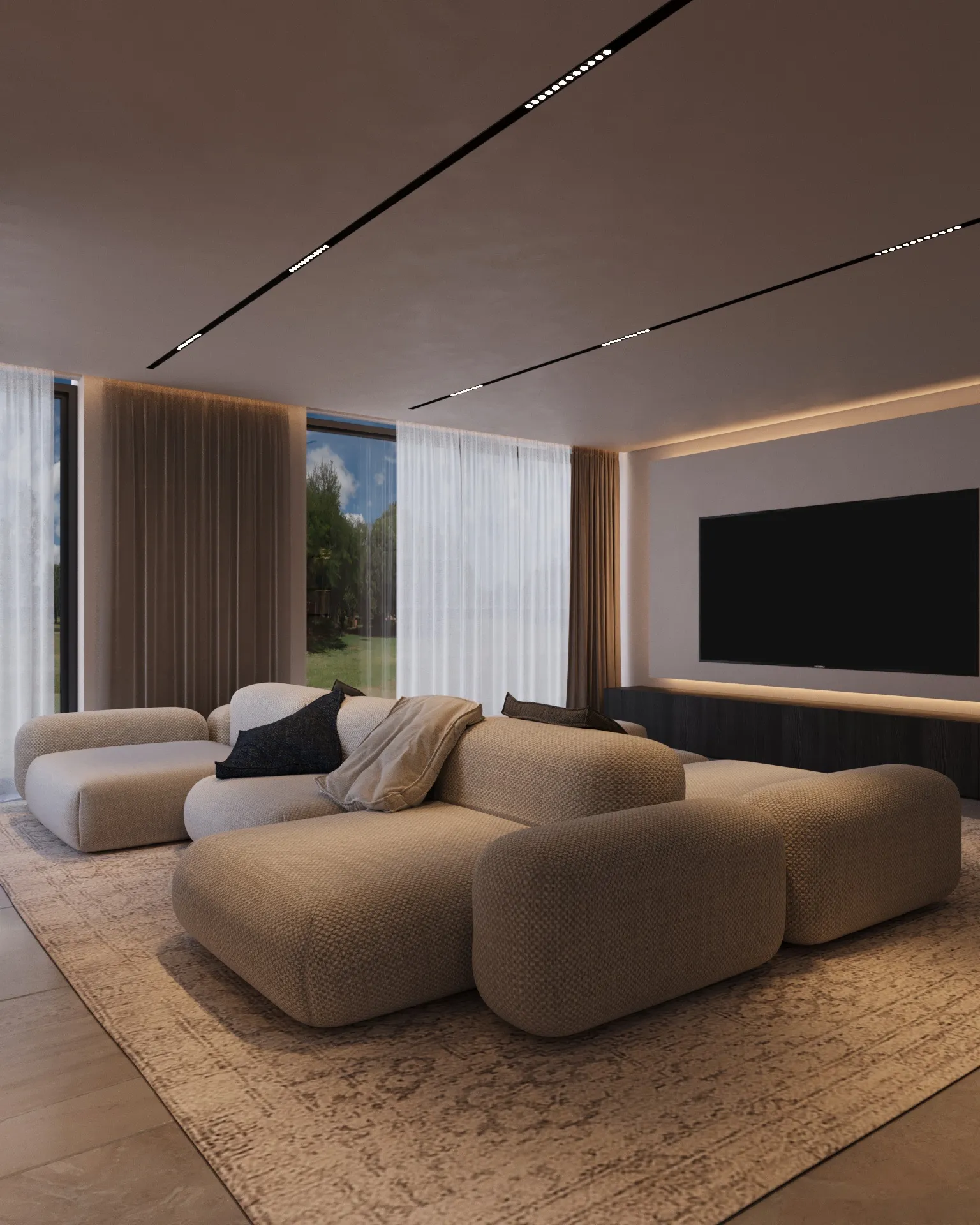 Sala de estar moderna com sofá modular bege, almofadas escuras, grande tapete e televisão montada na parede.