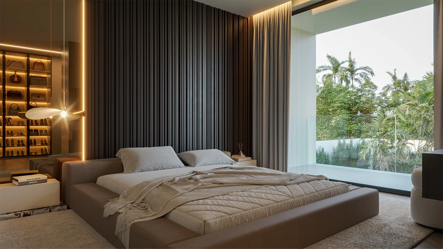 Sala de estar moderna com sofá bege, mesa de centro escura com livros e xícara, TV embutida na parede e vasos decorativos com galhos secos.