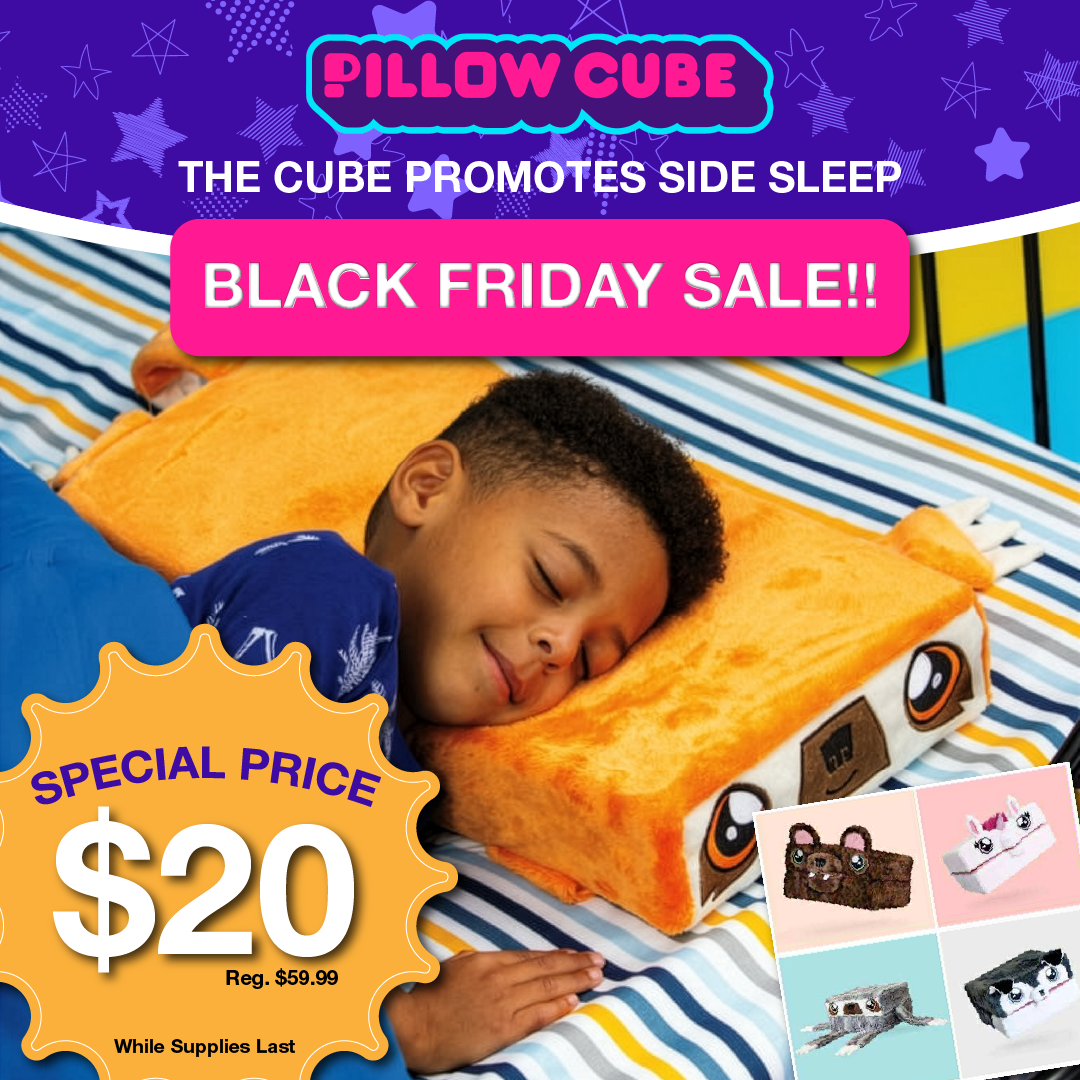 Young boy sleeping on a animal shaped pillow